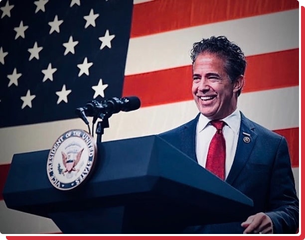 michael bishop standing at a presidential podium